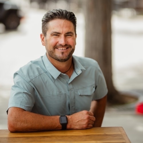 Photo of Moses Horner sitting at a wooden table